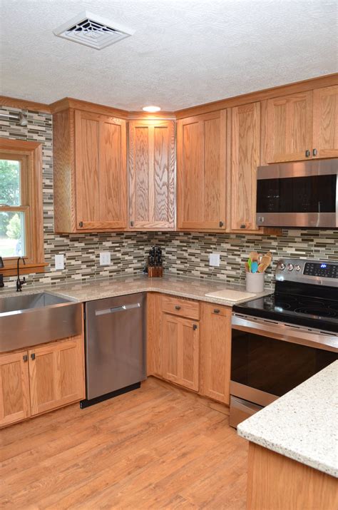 stainless steel vs black stainless with honey oak cabinets|yellow honey oak cabinets.